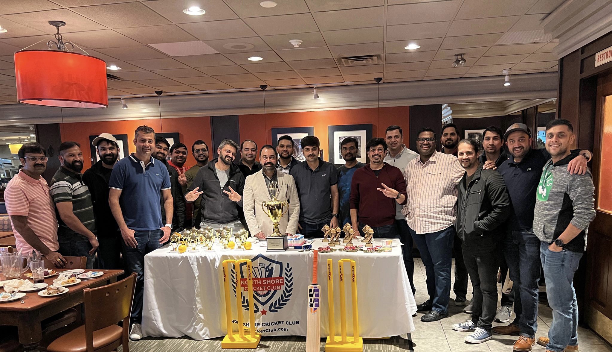North Shore Cricket Club members with trophies